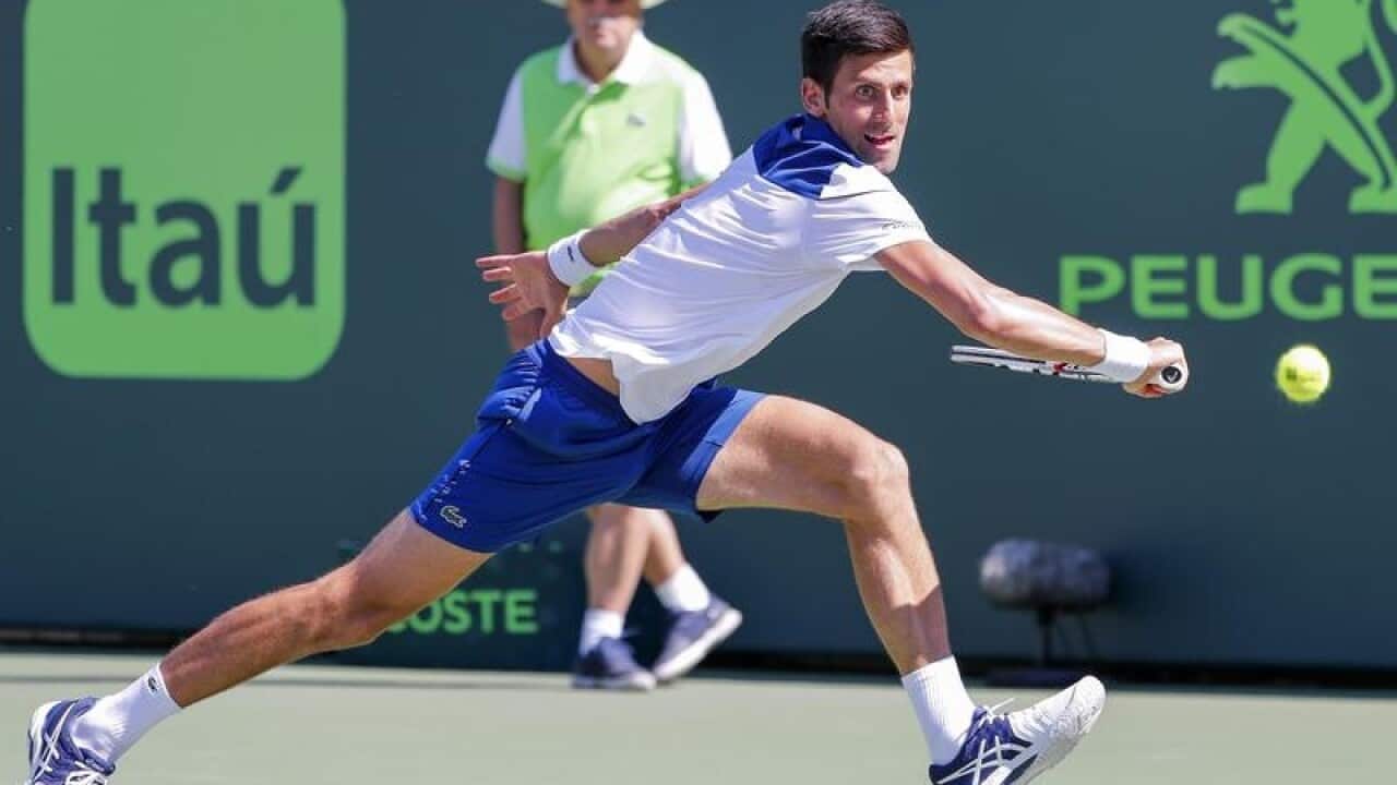 Novak Djokovic of Serbia in action against Benoit Paire of France.