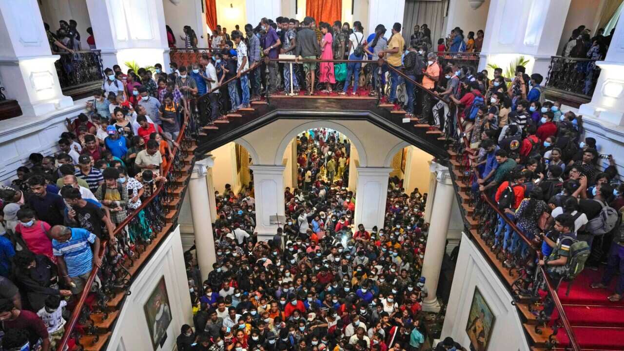 People throng President Gotabaya Rajapaksa’s official residence for the second day after it was stormed in Colombo, Sri Lanka, Monday, July 11, 2022.
