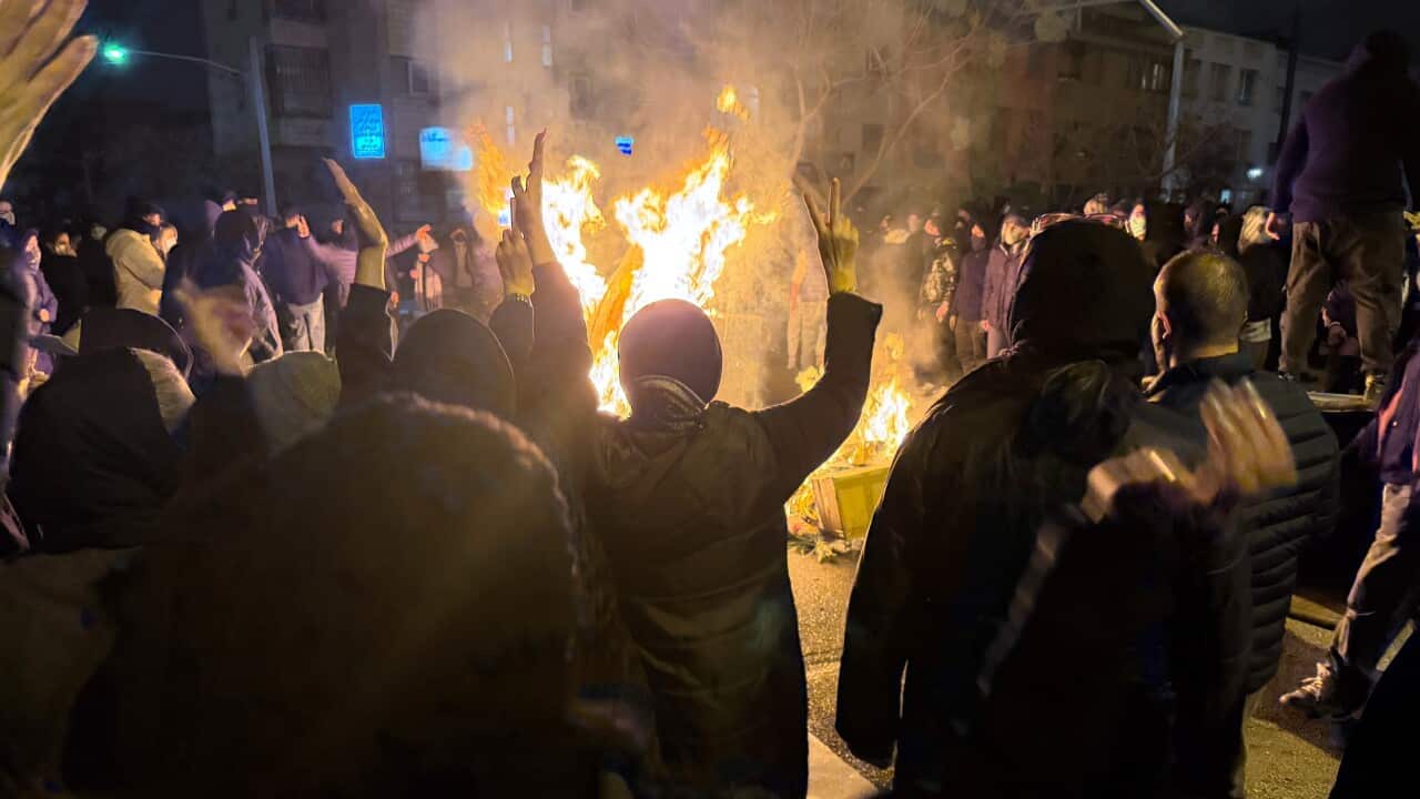 Iranians attend an anti-government protest in Tehran