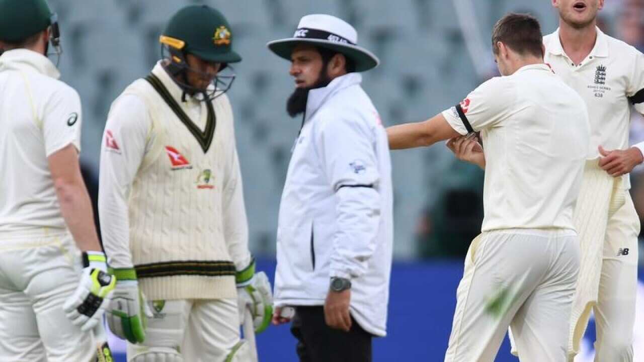 England's Stuart Broad (far r) and Steve Smith (far l) have words.