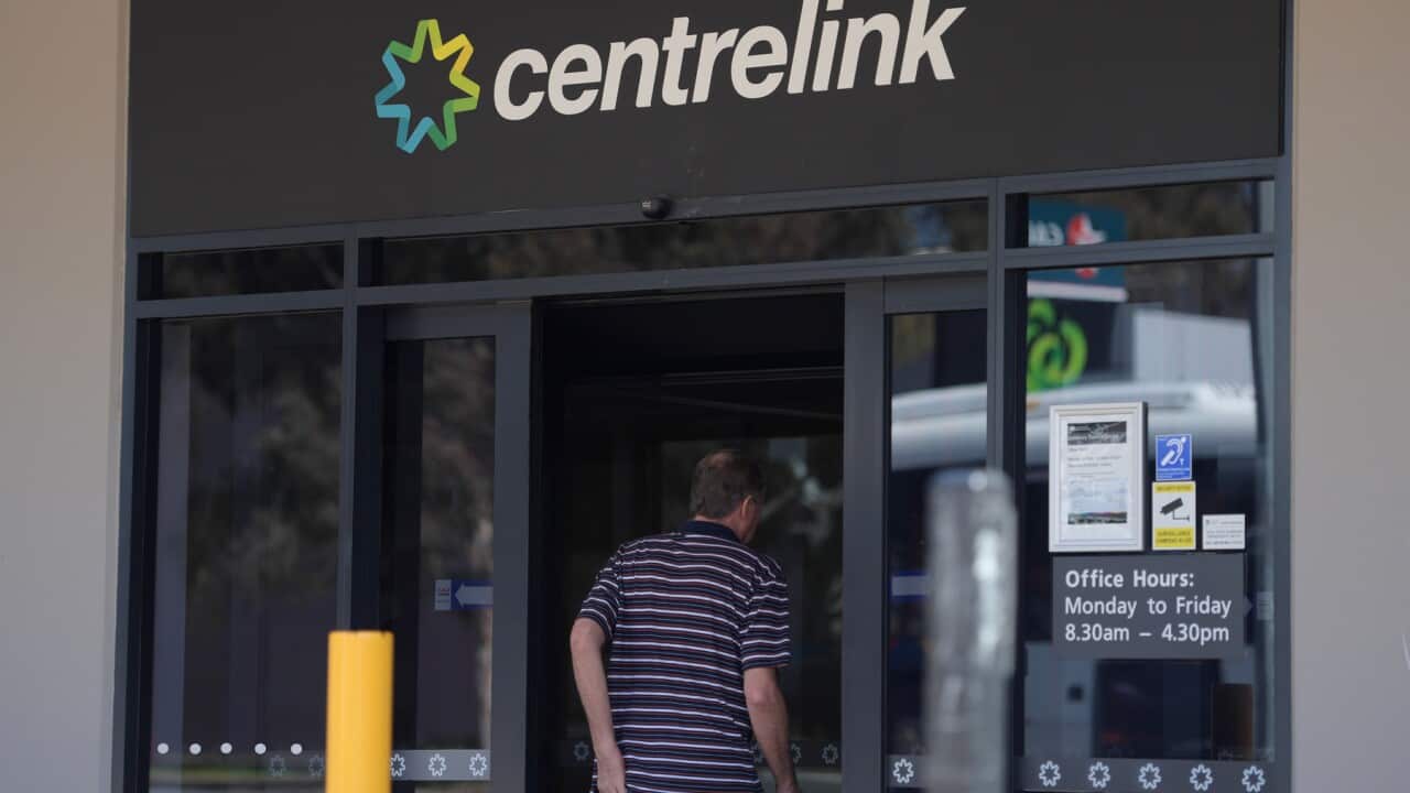 A man walking into a Centrelink office