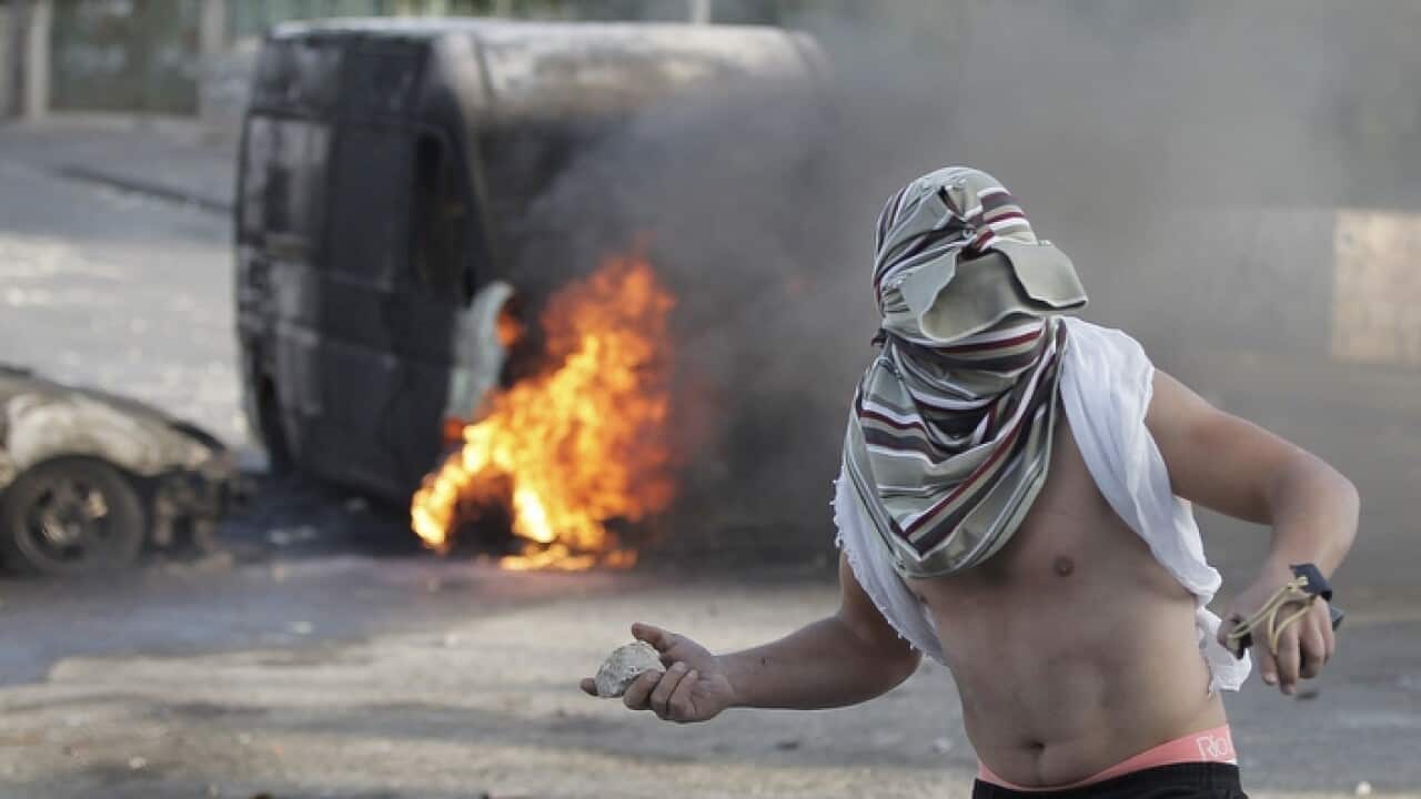 palestinian_youth_throwing_rocks_at_the_protests_getty_larger.jpg
