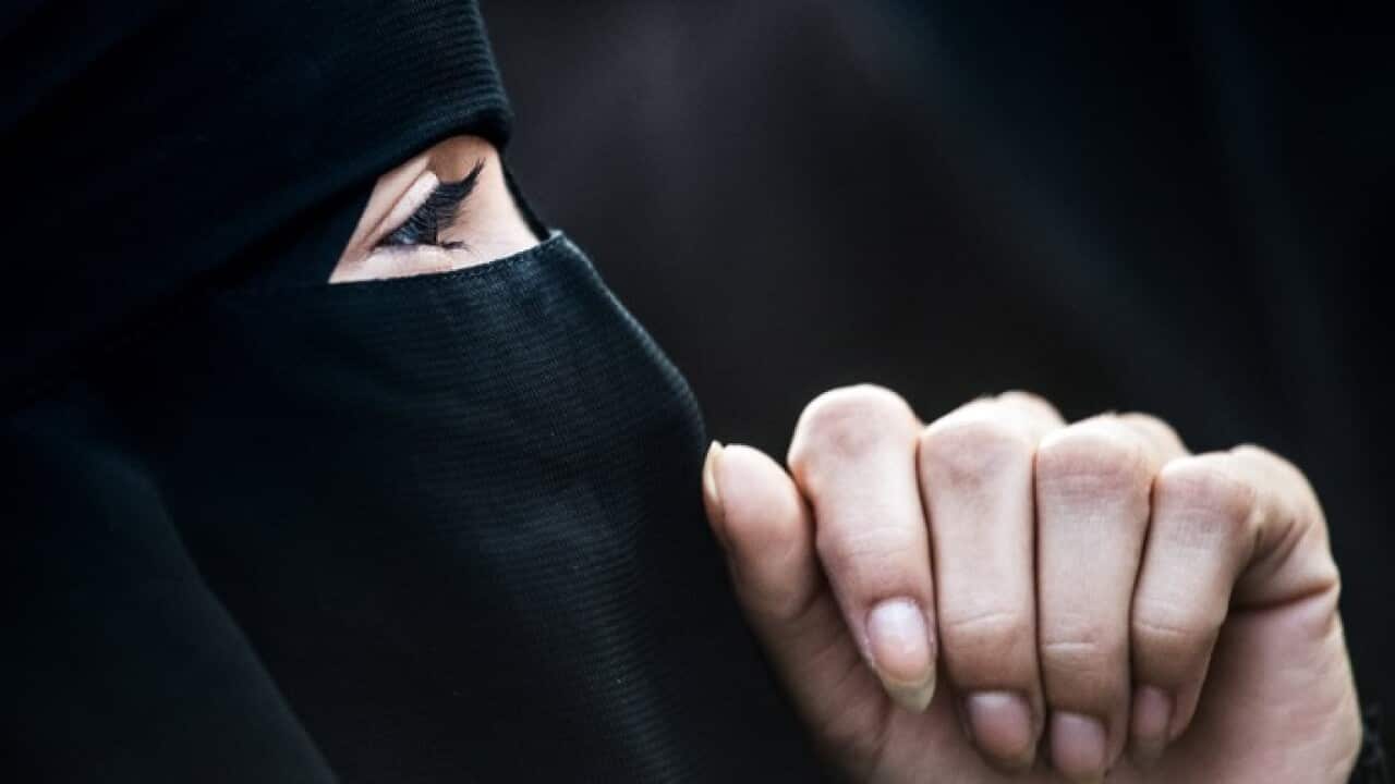 A protestor wears a niqab during a demonstration against a full-face veil ban in Vienna, Austria, 01 October 2017. The new law bans full-face veils in public places from 01 October 2017 on and says faces must be visible from the hairline to the chin. It b