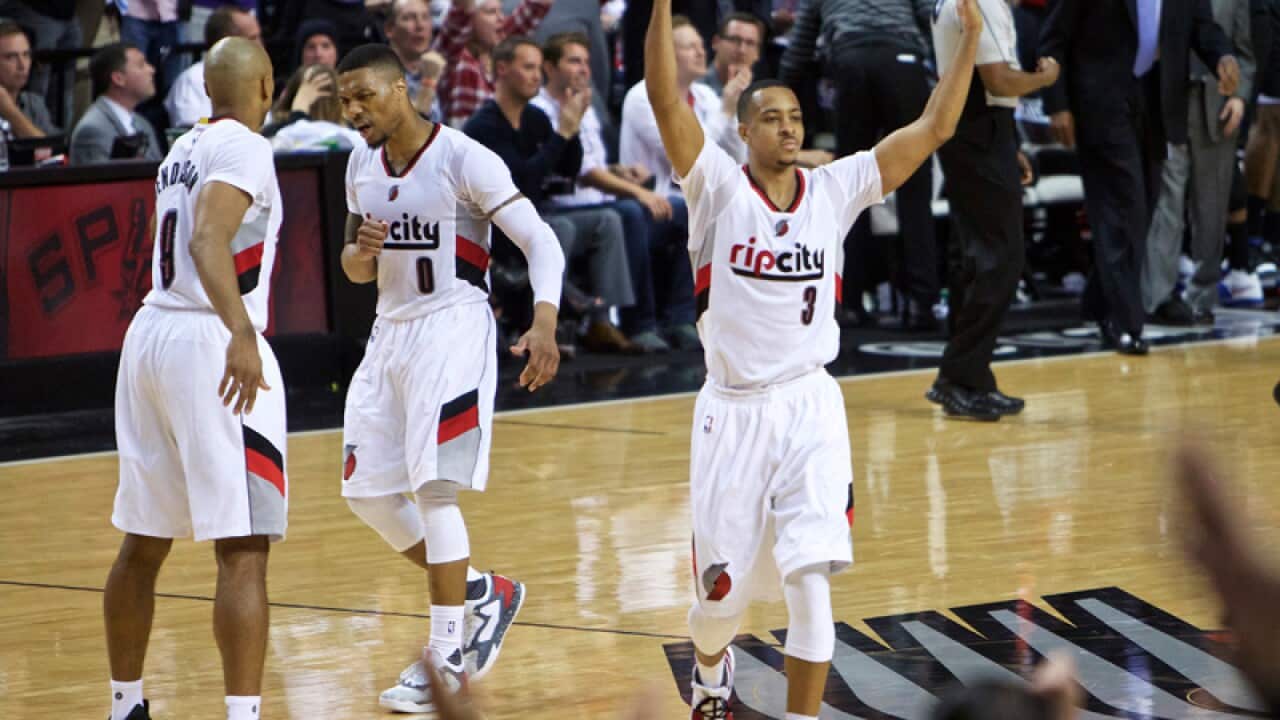 Portland Trail Blazers guard C.J. McCollum reacts