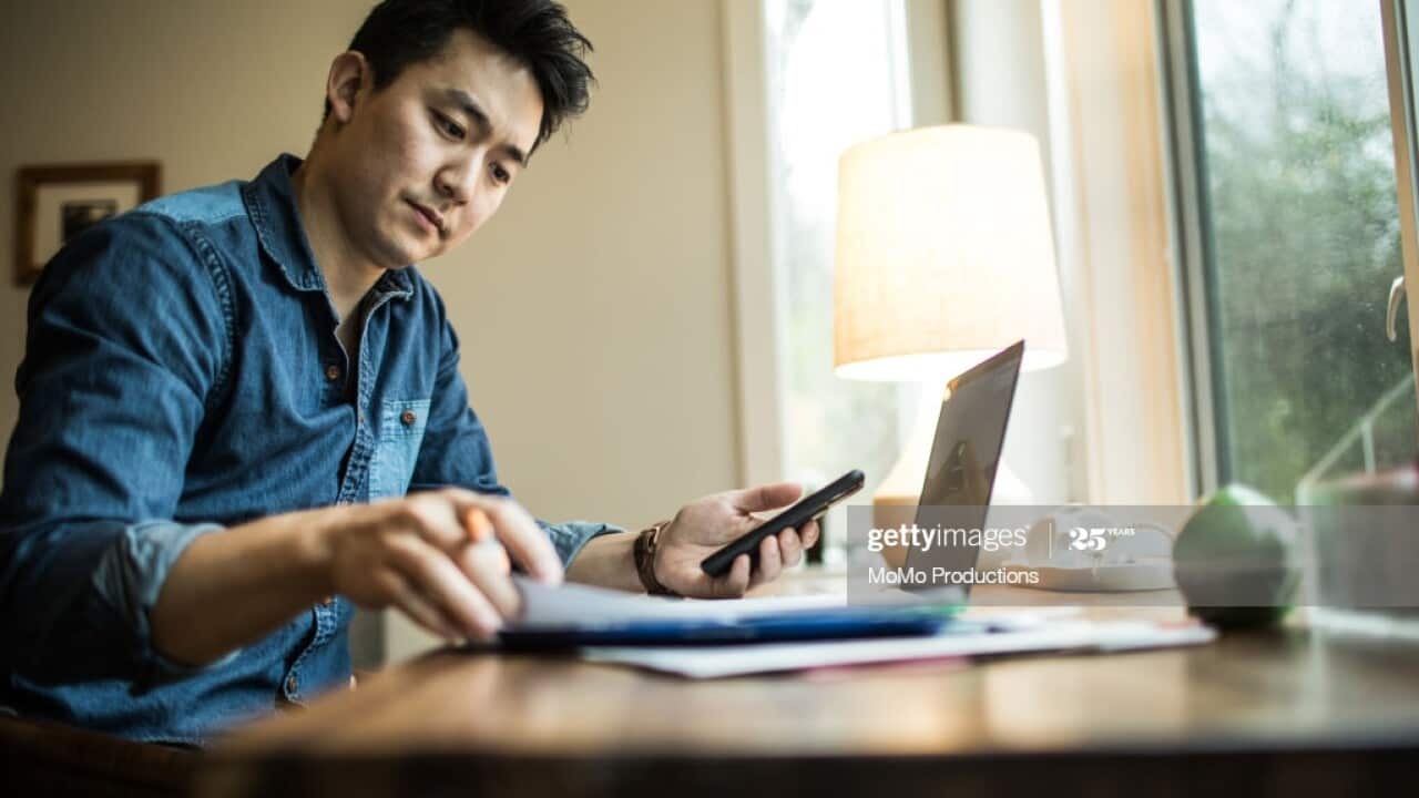 Man (early 30s) working in home office