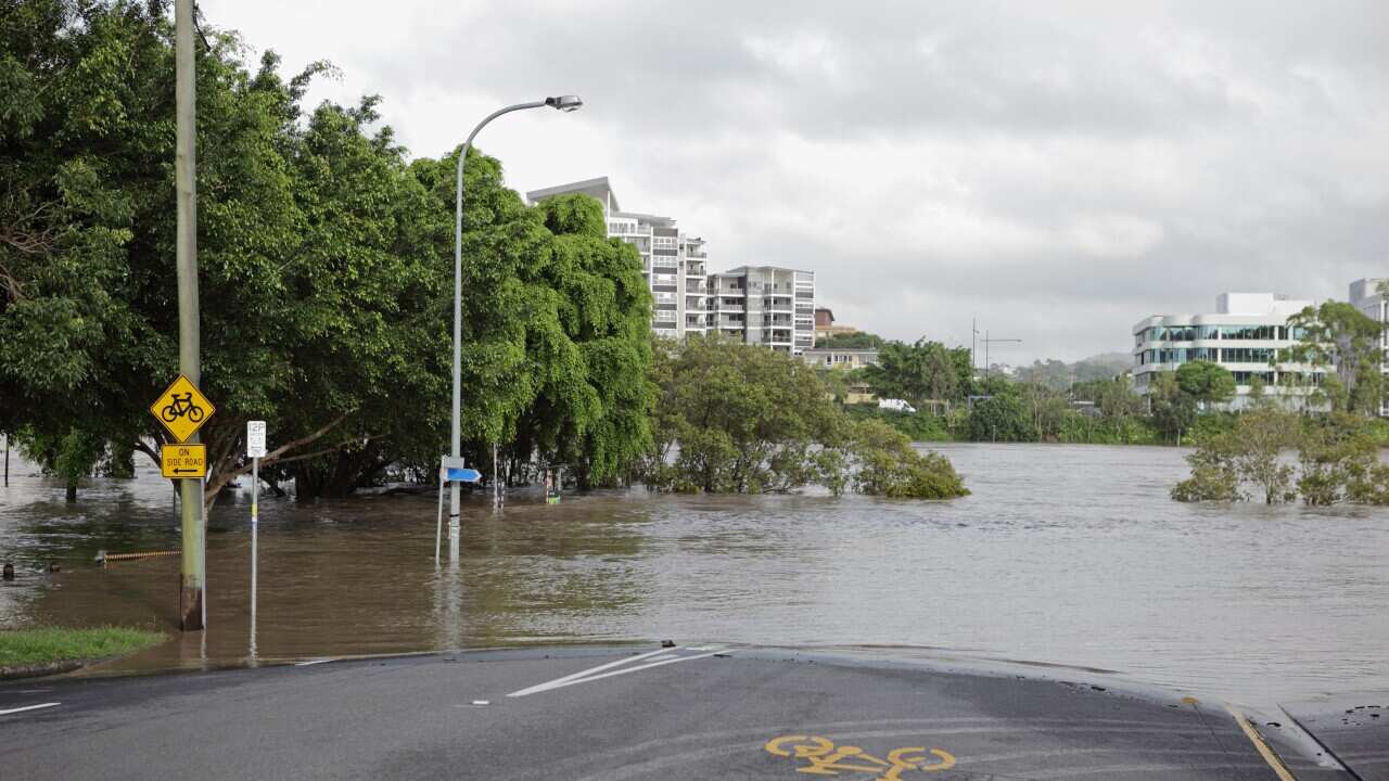 Flooded river over road