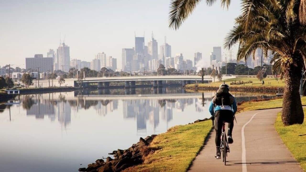 A cyclist is seen riding on the bicycle lane along Maribyrnong River.