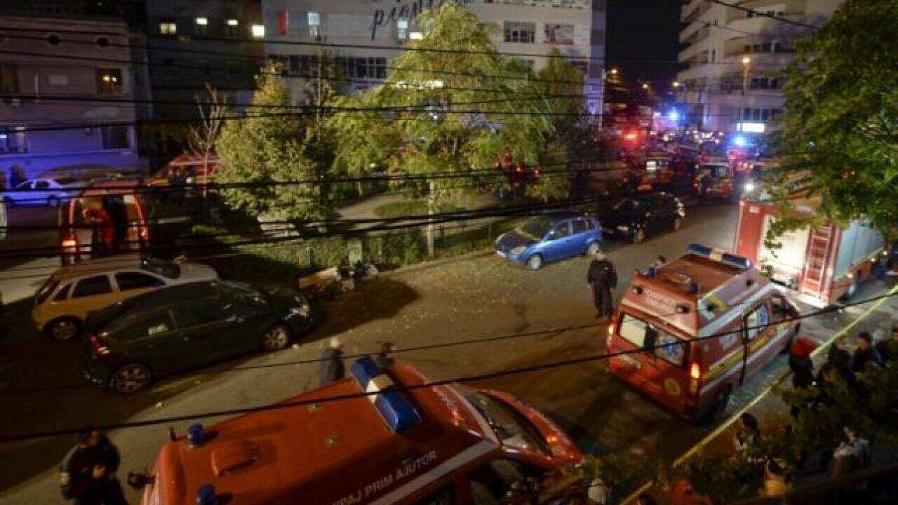 Emergency services work outside a nightclub in Bucharest