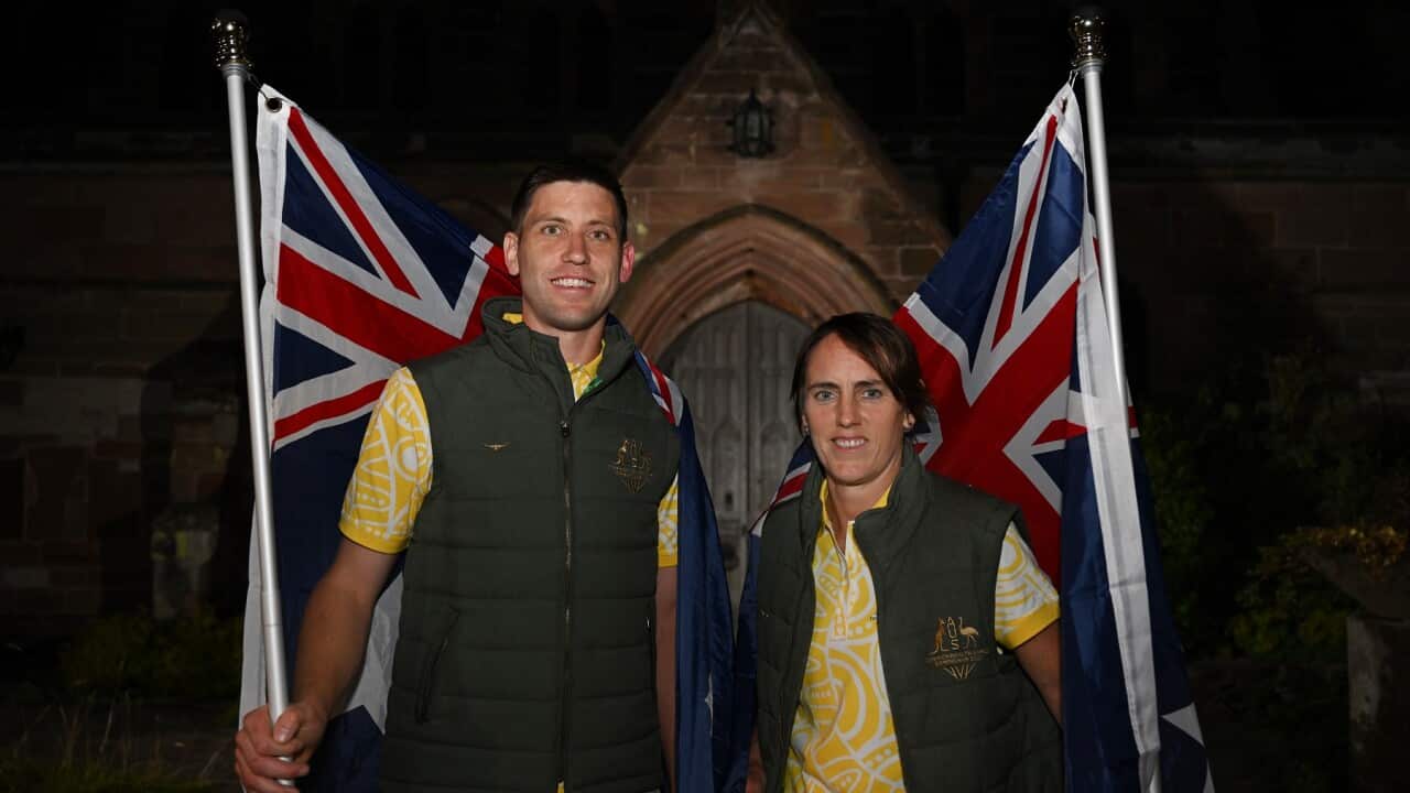 Australian Team flag-bearers Squash player Rachel Grinham (left) and Kookaburras co-captain Eddie Ockenden