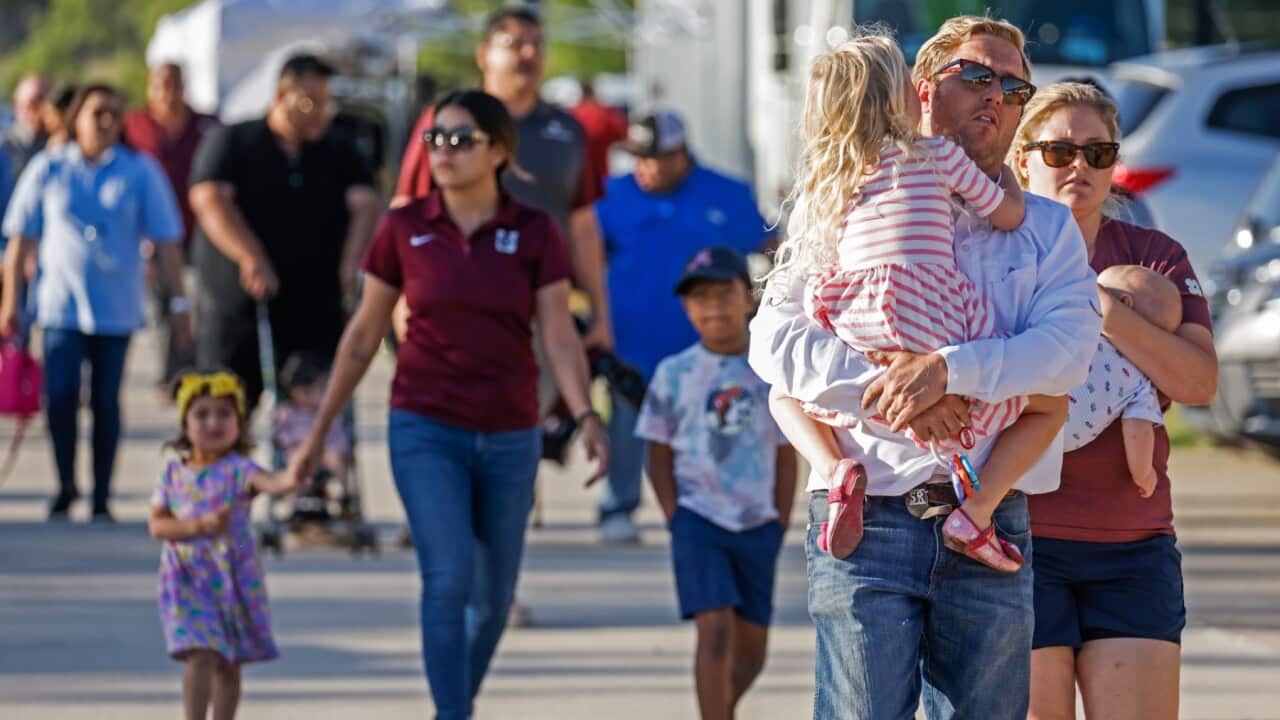 People arrive to attend a community gathering, at the Uvadle County Fairplex, following a mass shooting at the Robb Elementary School in Uvalde, Texas.