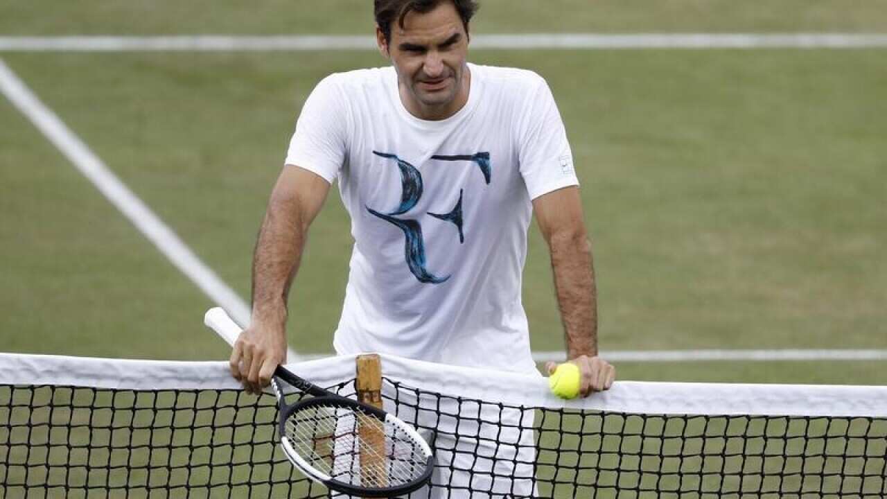 Roger Federer of Switzerland looks on during a training.