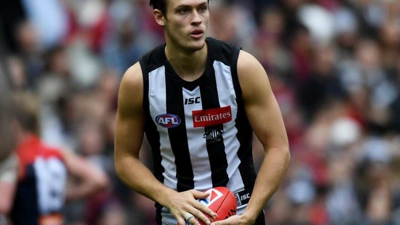 A file image of Darcy Moore of the Magpies preparing to kick the ball.