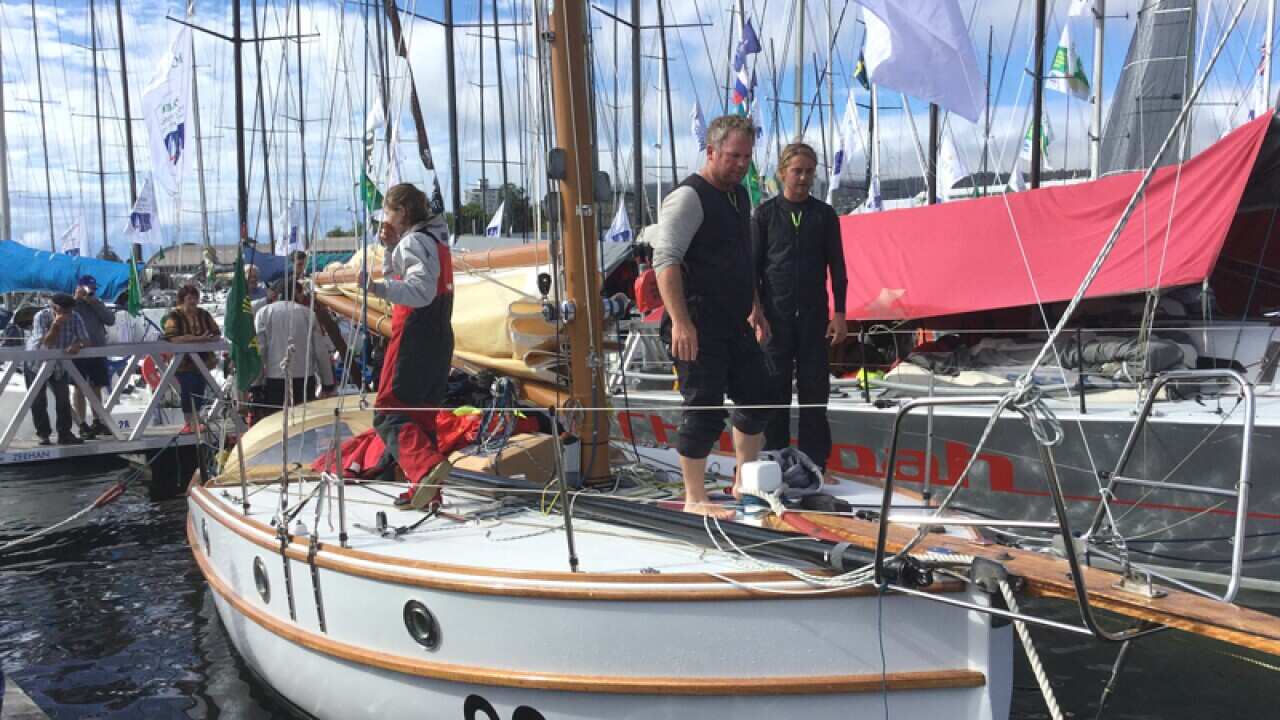 Sean Langman and son tie up their boat Maluka of Kermandie