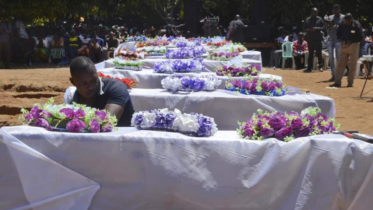 The coffins of some of the victims awaiting burial