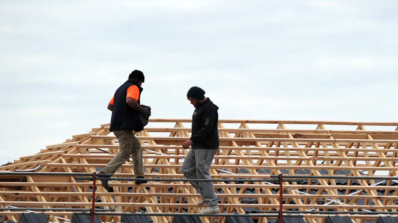 Construction workers build