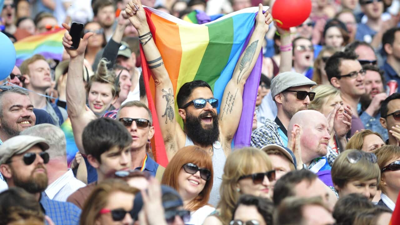People reacting to results coming in from constituencies around Ireland suggesting an overwhelming majority in favour of the referendum on same-sex marriage, in Dublin, Ireland (EPA/AIDAN CRAWLEY)