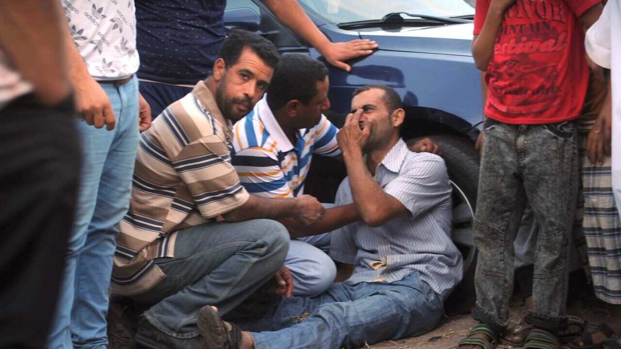A relative of a missing person on the capsized boat reacts as he waits for rescue workers, the port city of Rosetta, some 250km north of Cairo, Egypt