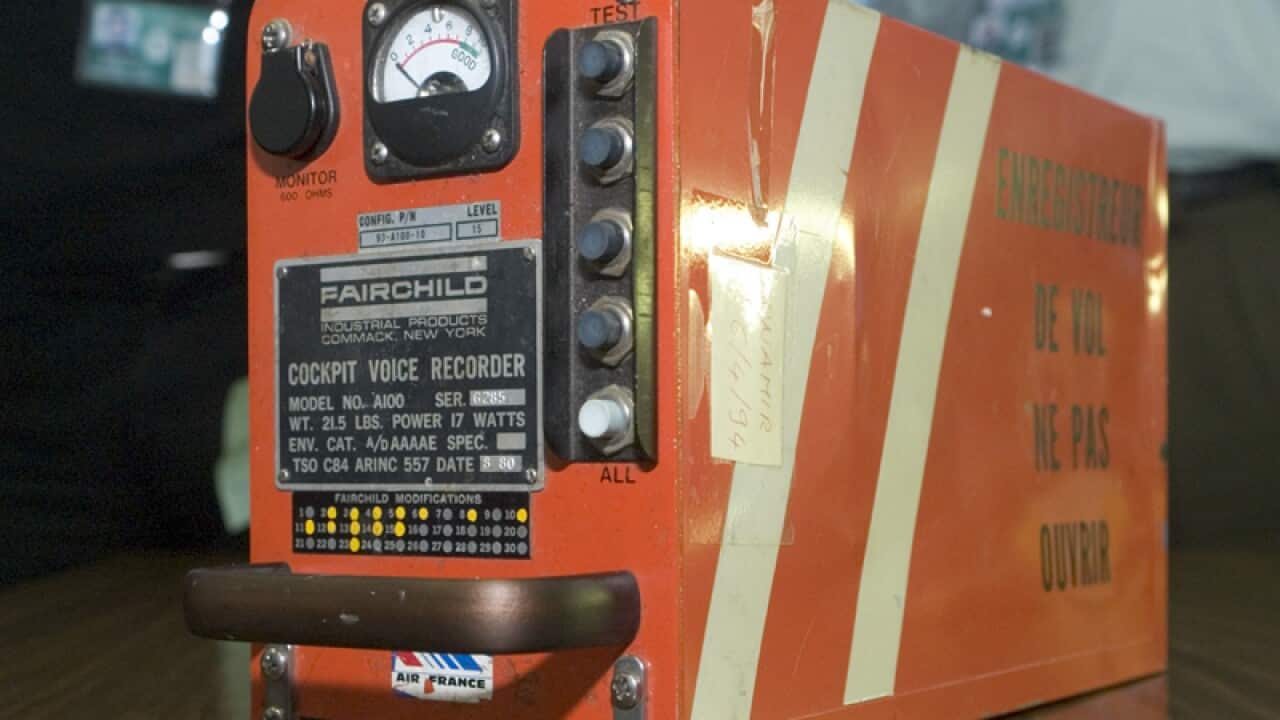 A pro-Russian fighter places a black box from the crashed MH17