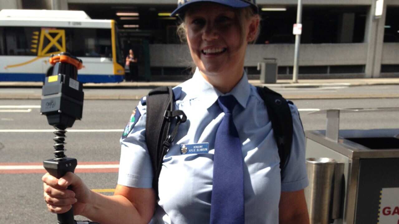 Sergeant Kylie Blumson display the new Zebedee scanner in Brisbane