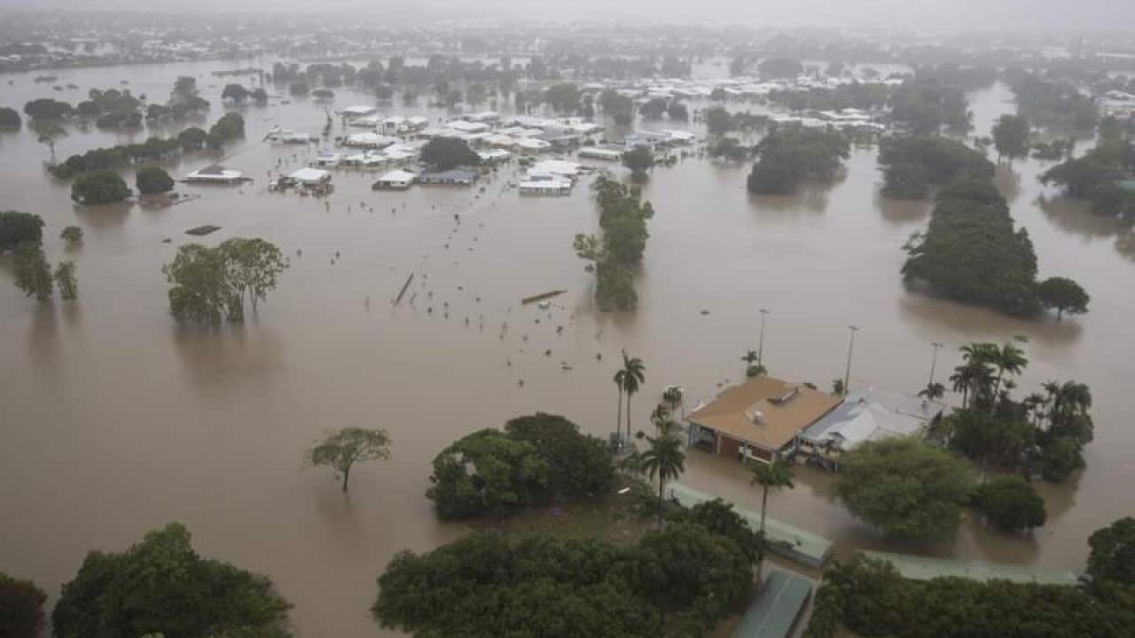 Houses are inundated with flood waters in Townsville