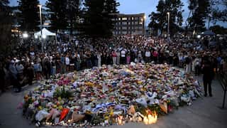 Mourners attend a vigil at a memorial in Bondi Beach, Sydney