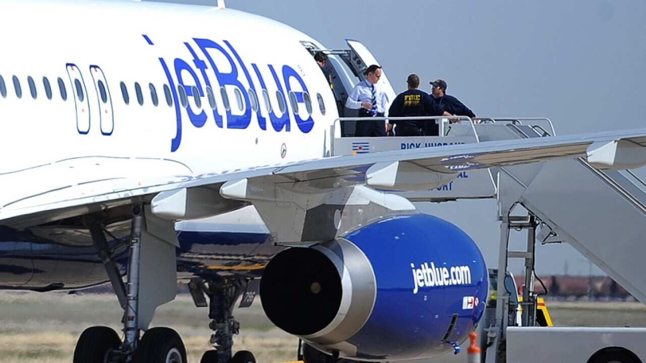 Authorities board a JetBlue flight