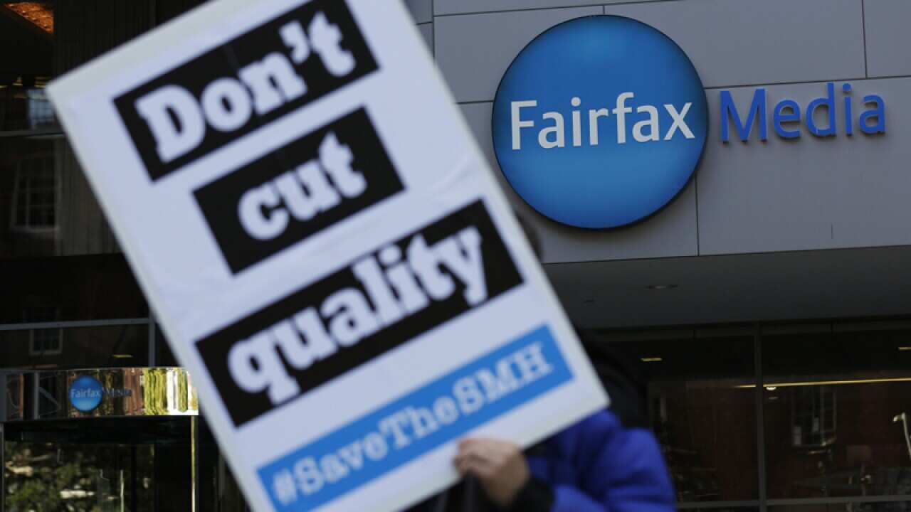 A Fairfax employee protests outside the Fairfax Media offices