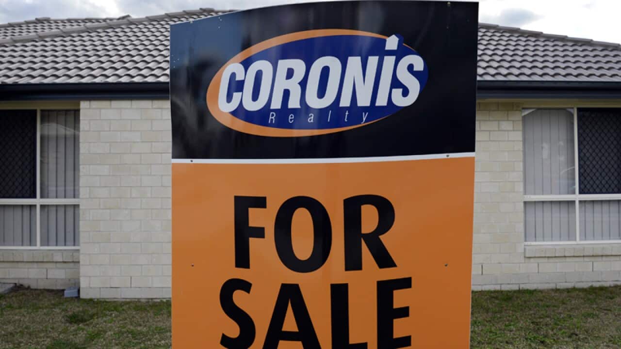 A "For Sale" sign for a home in Brisbane