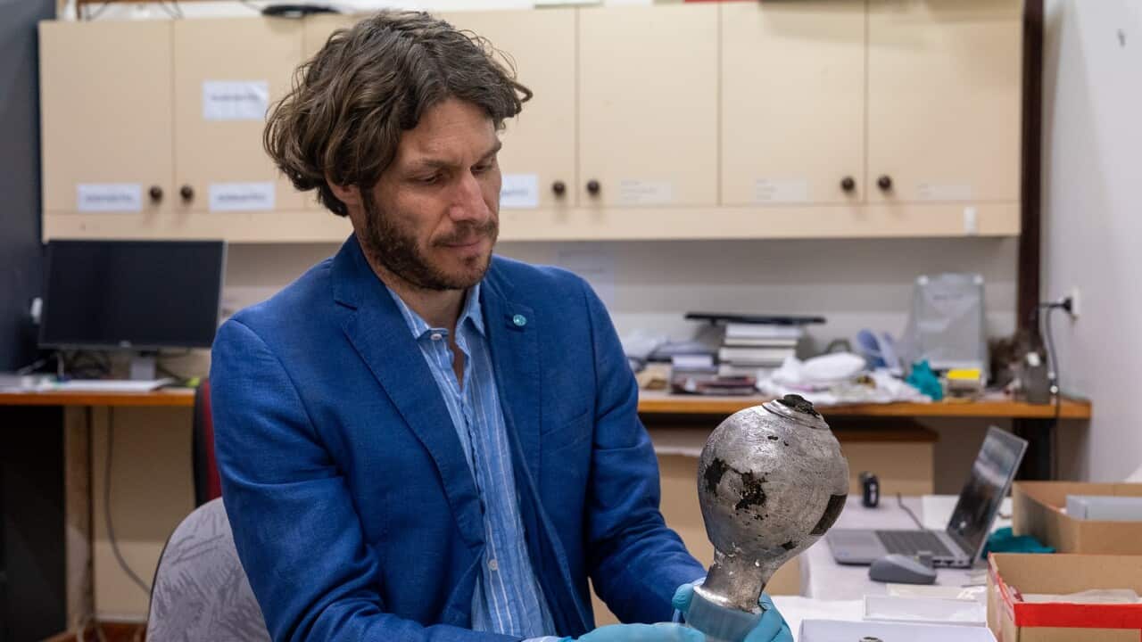 Arvi Wattel examining Batavia silver (Supplied Credit Jarryd Gardner).jpg
