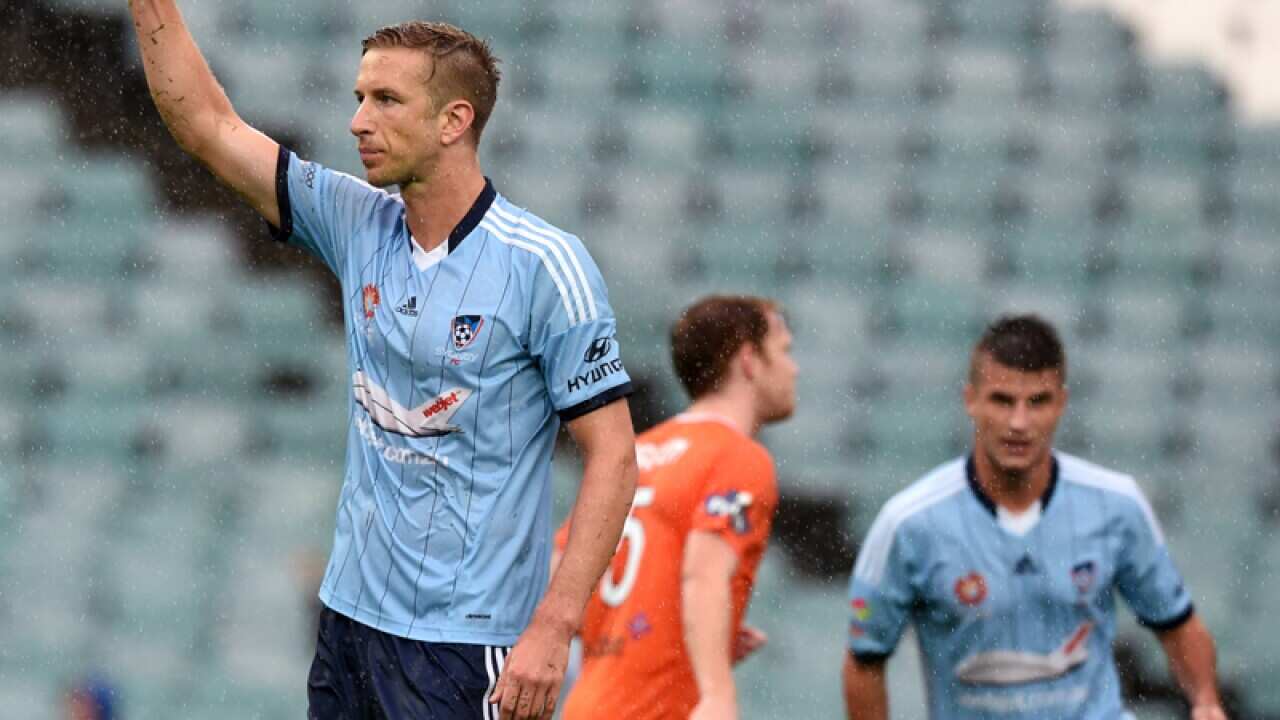 Sydney FC's Mark Janko scores a goal against the Brisbane Roar