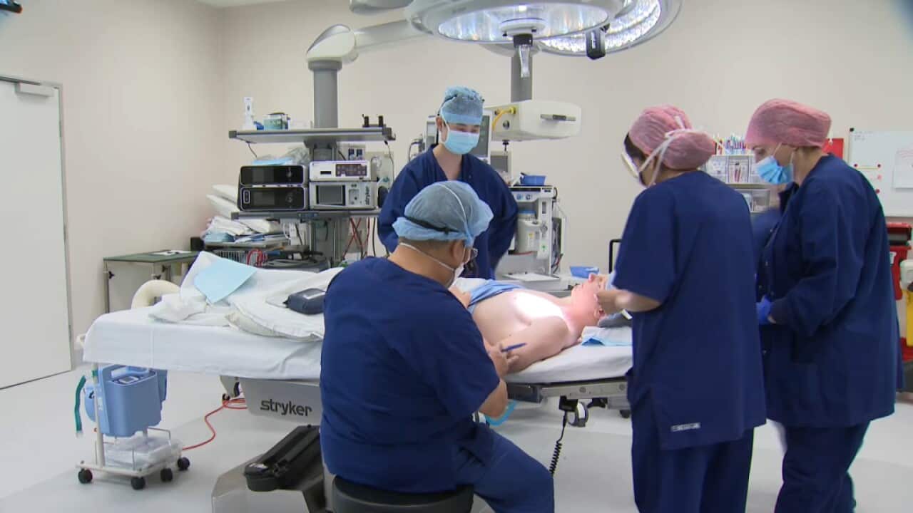 Michael Leung in the operating theatre (SBS).jpg