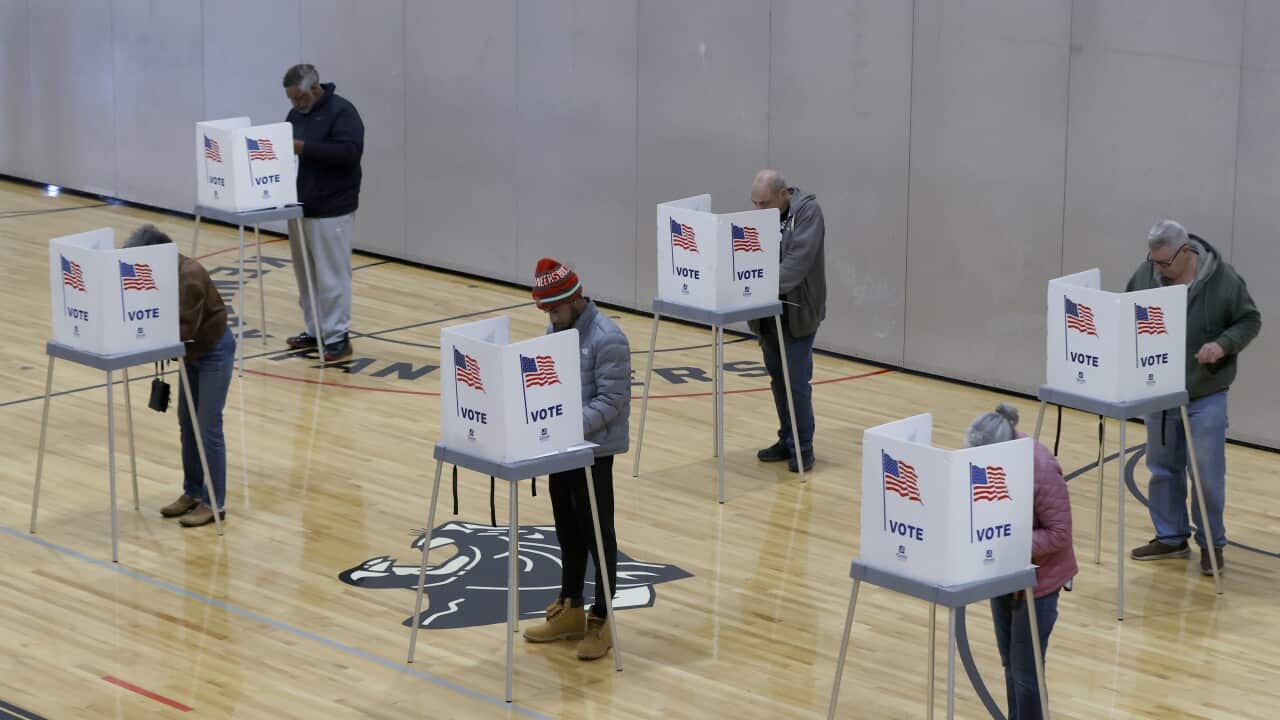 Voters cast their ballots inside a gymnasium in Michigan