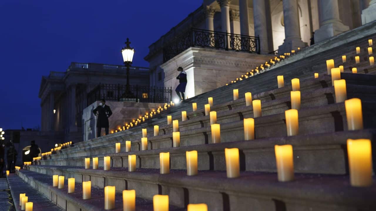 Candles are placed on the steps of the Capitol to mark the anniversary of the insurrection