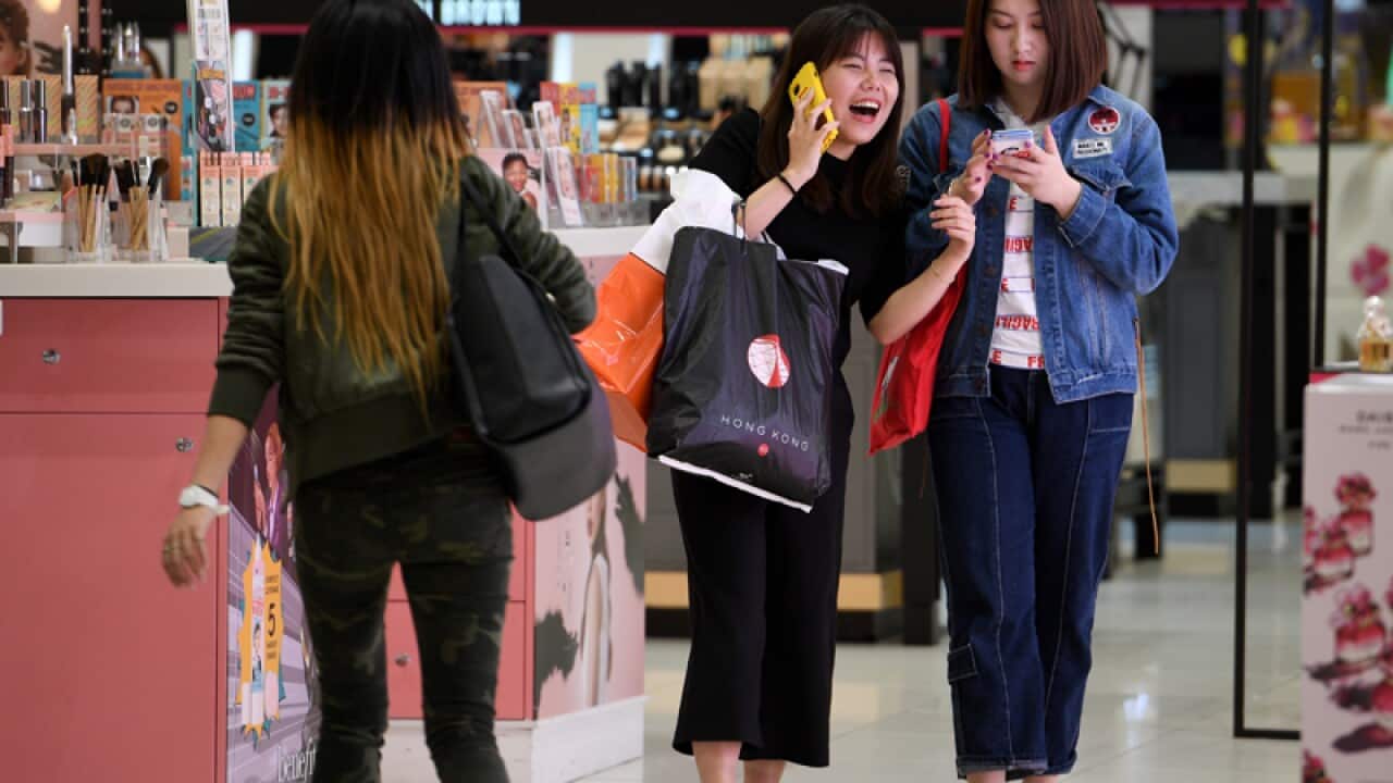 Shoppers are seen in Sydney