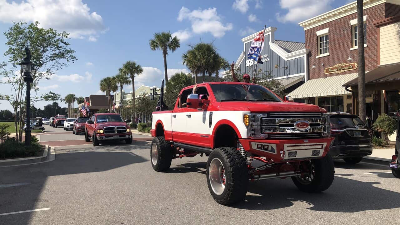 Donald Trump’s supporters parade in Florida’s streets during the campaign (SBS).