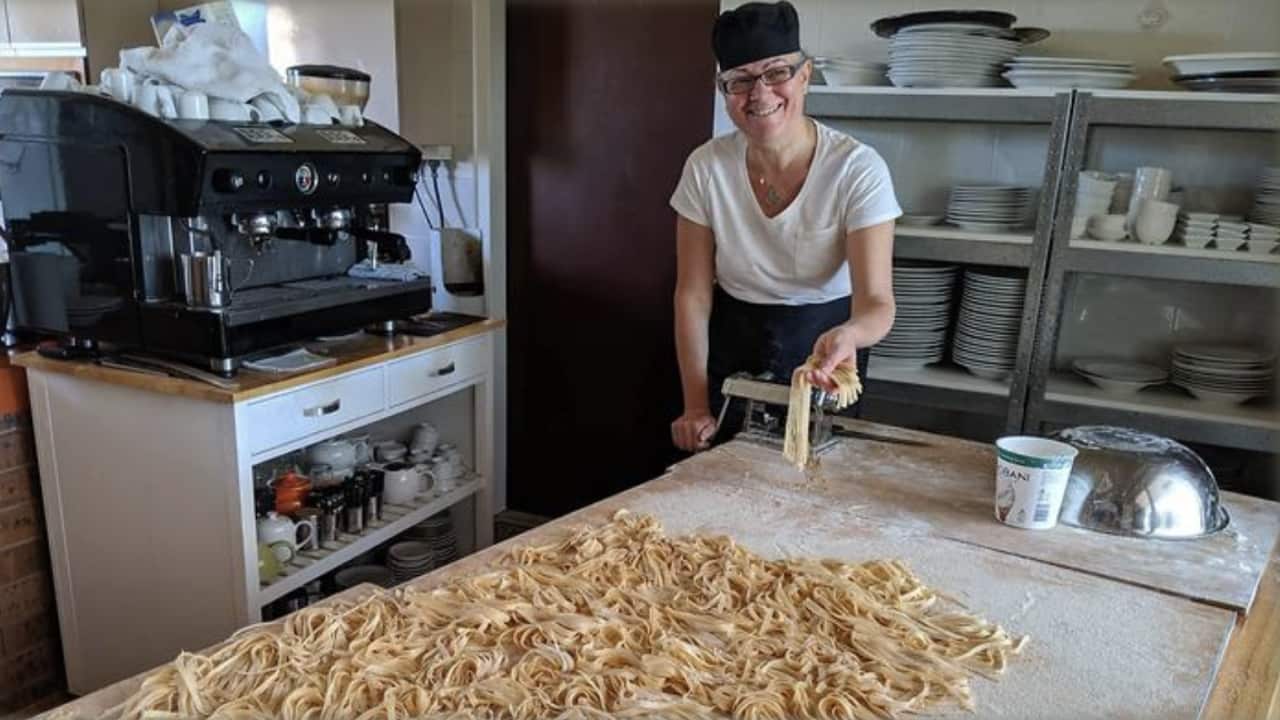 Lucia Di Luca making pasta.