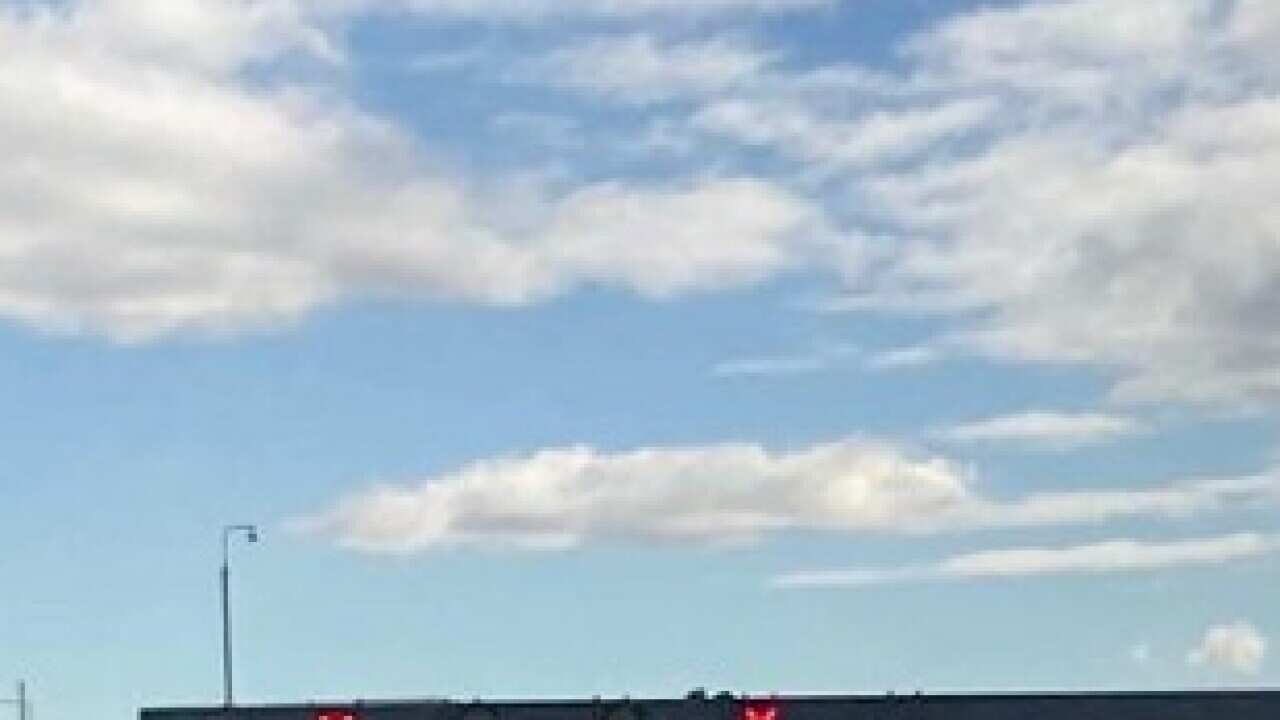 Police say officers were negotiating with a man on the Monash Freeway when the shooting occurred.