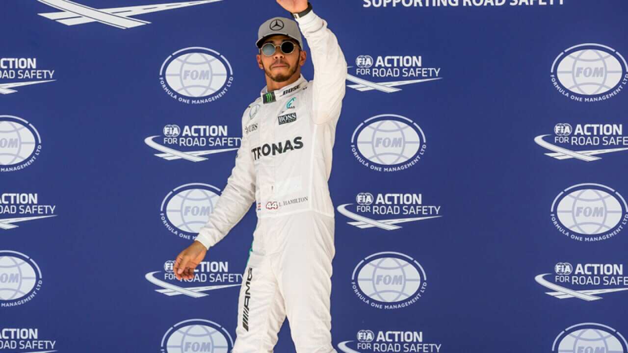 Lewis Hamilton (GBR) Mercedes AMG F1 celebrates his pole position