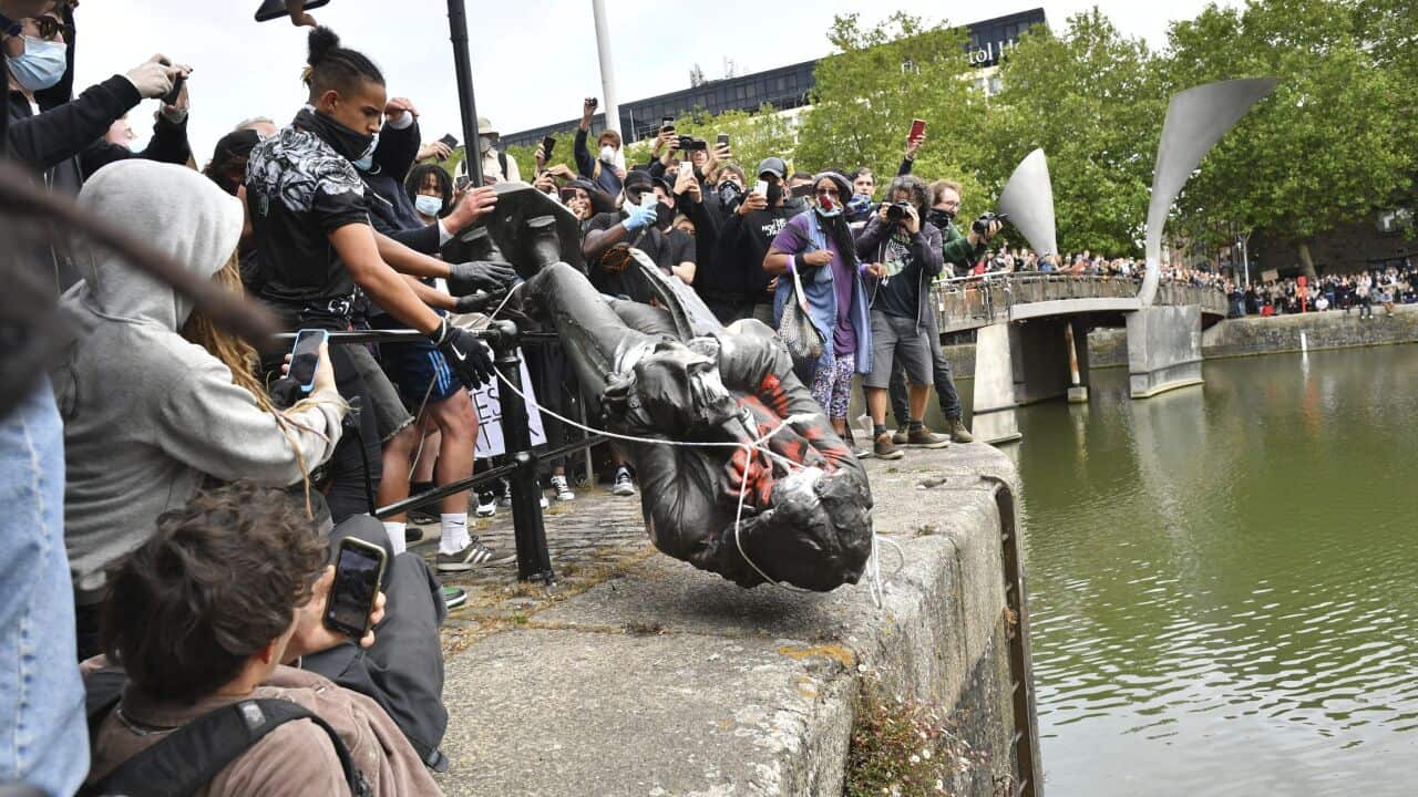Protesters throw a statue of slave trader Edward Colston into Bristol harbour, during a Black Lives Matter protest rally, in Bristol, England. 