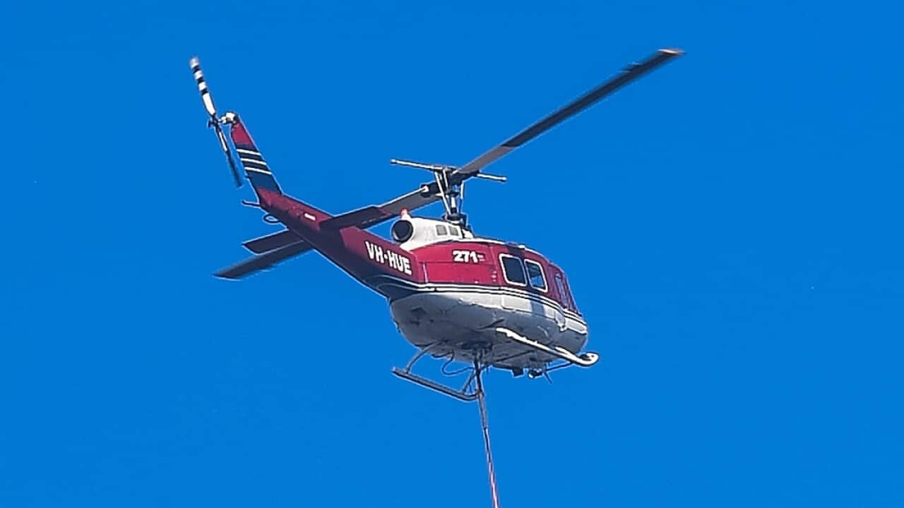 The UH-1H helicopter during the Menai bushfires in Sydney on April 16 before it crashed in Kosciuszko National Park.