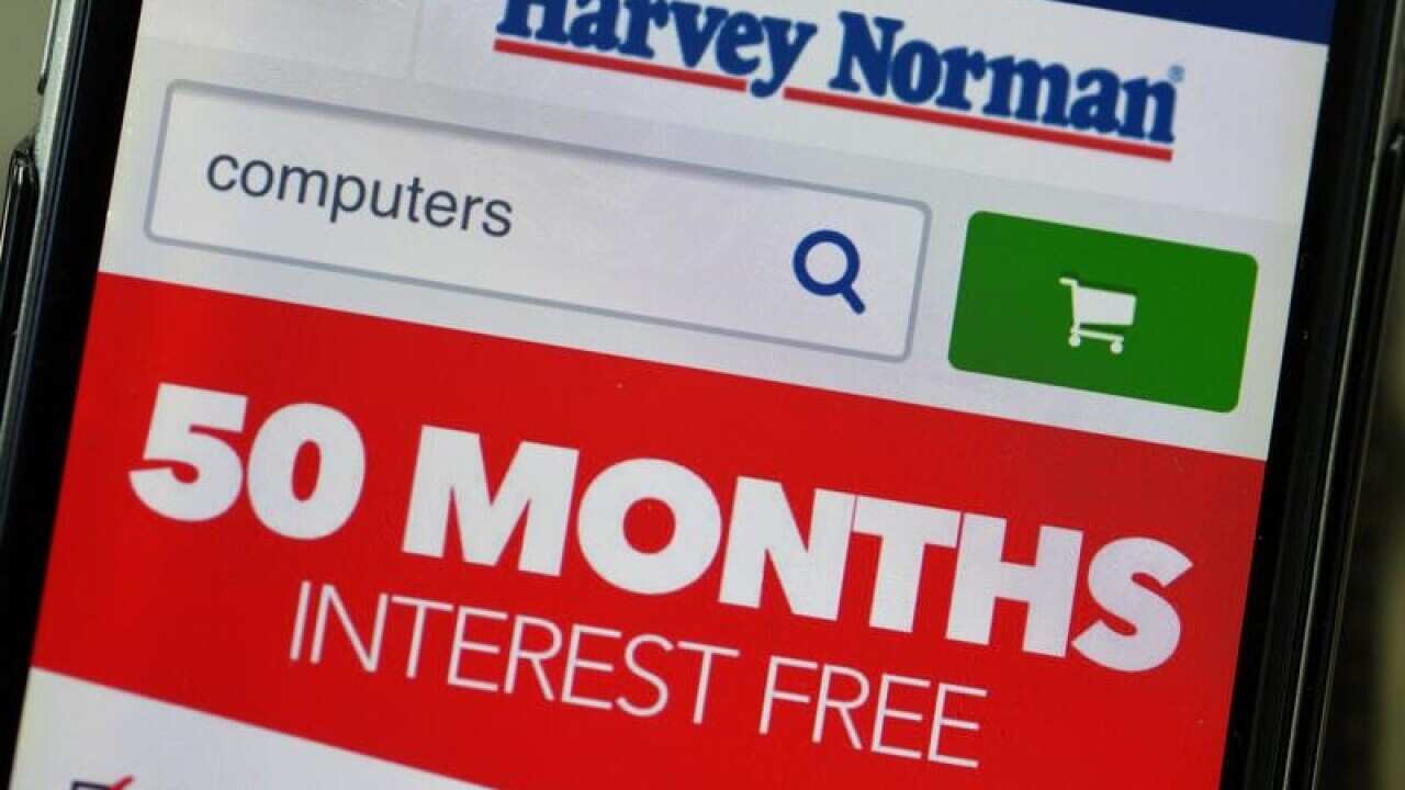 Harvey Norman website is seen on a phone