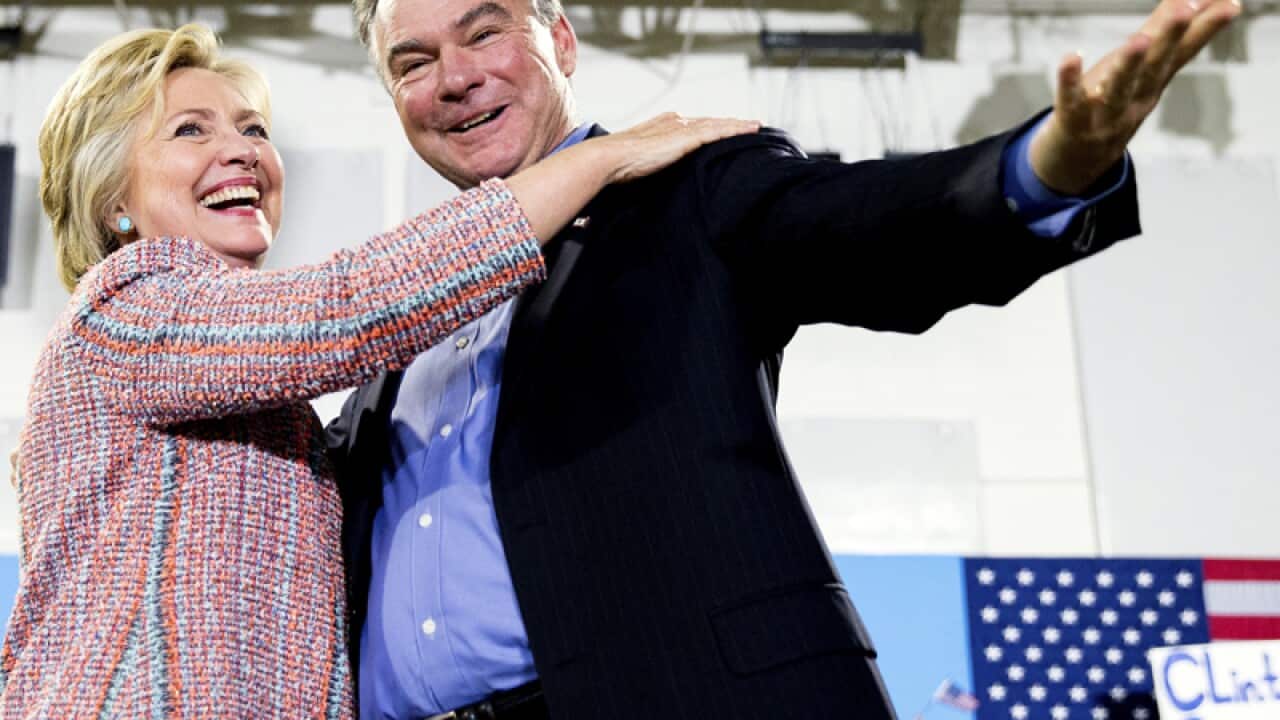 Hillary Clinton, accompanied by Sen. Tim Kaine