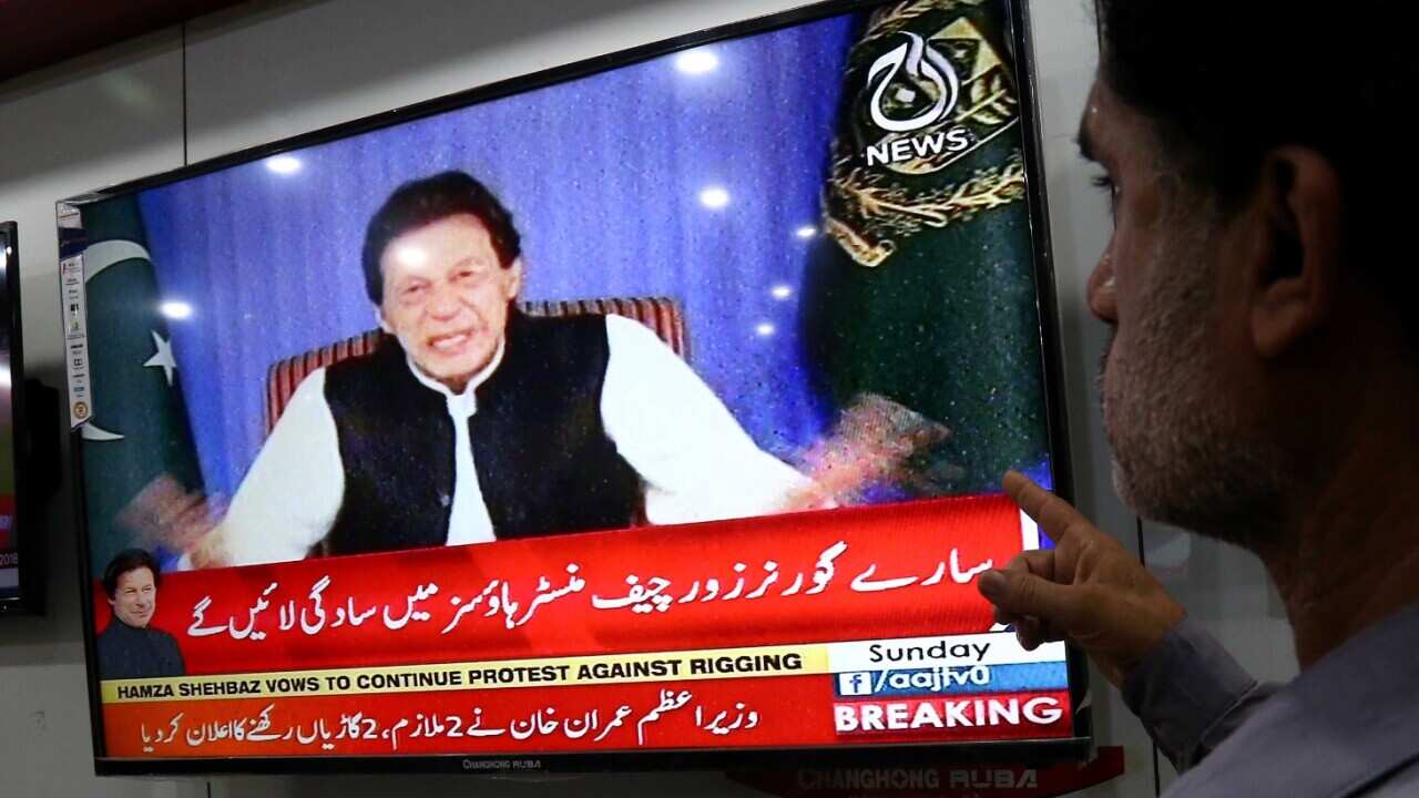 A man watches the televised address to the Nation of Pakistan's Prime Minister Imran Khan on a television in Karachi, Pakistan, 19 August 2018. 