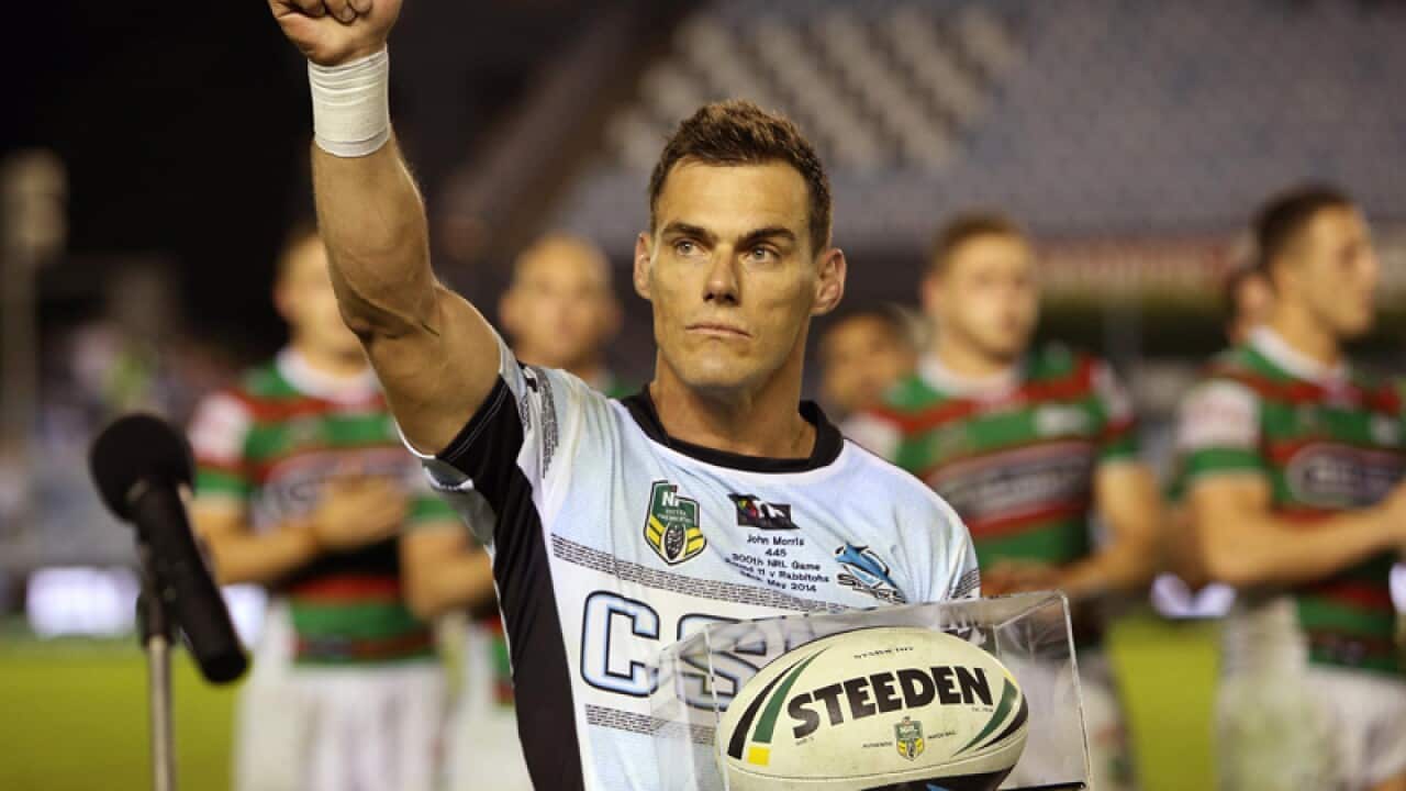 John Morris with the game ball for his 300th