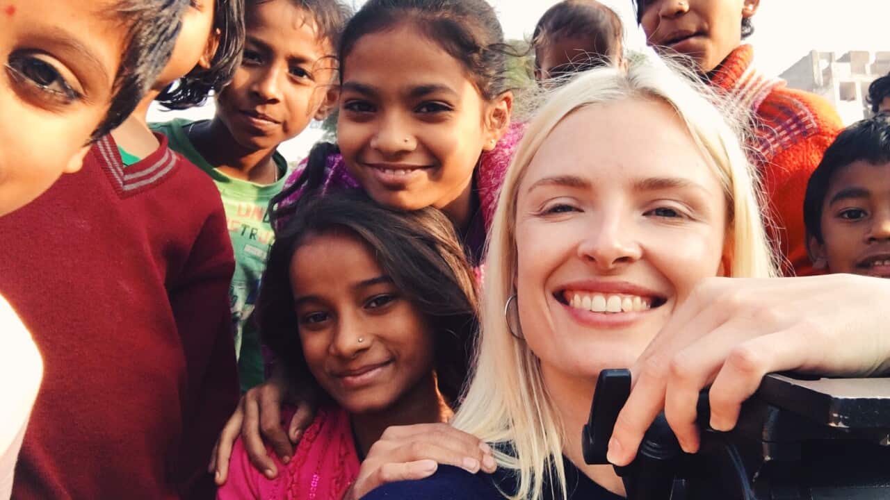 Dateline reporter Calliste Weitenberg with locals while reporting in India.