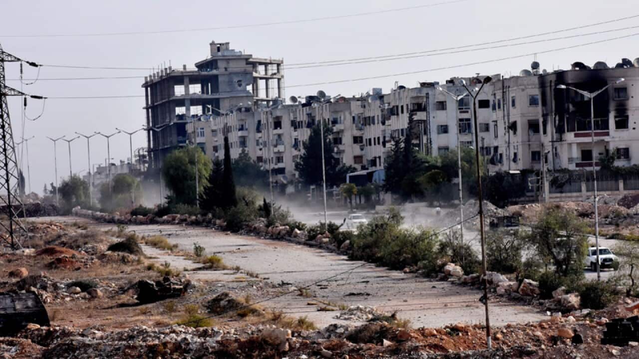Damaged buildings and rubble are seen in Aleppo