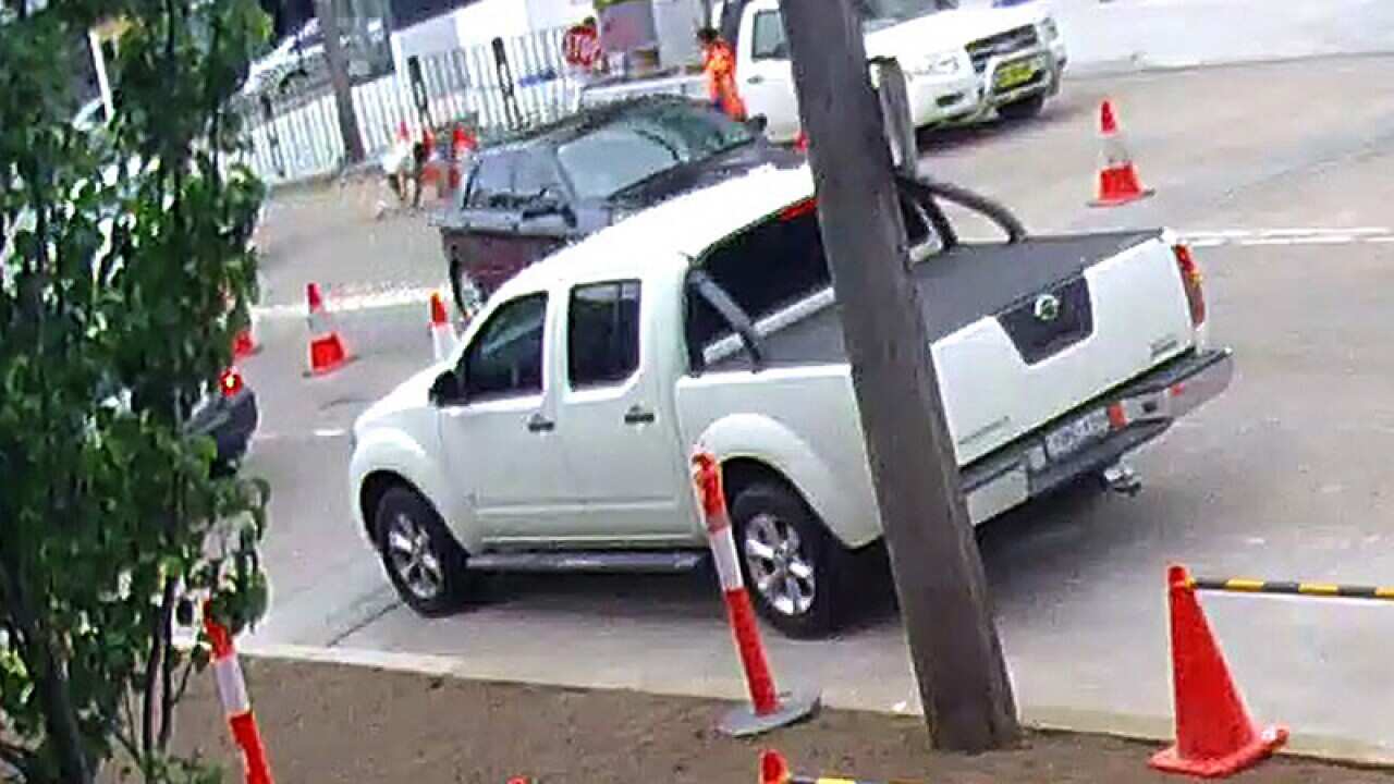 A man (back) is thrown from a car after his possessions were stolen