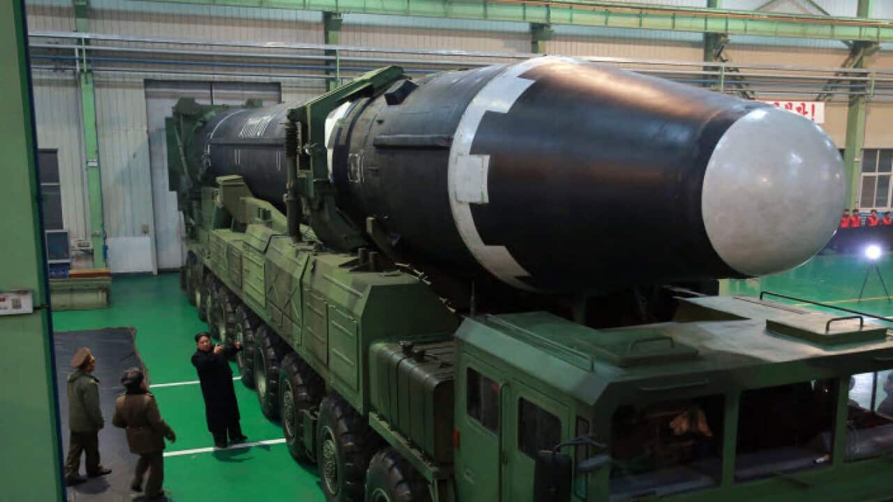 North Korean leader Kim Jong Un shows North Korea Ballistic
