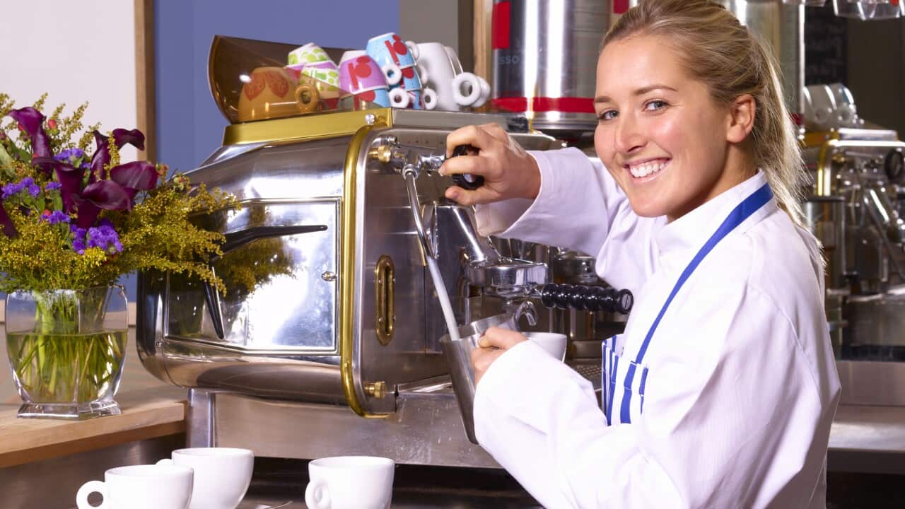 Waitress using coffee machine, portrait