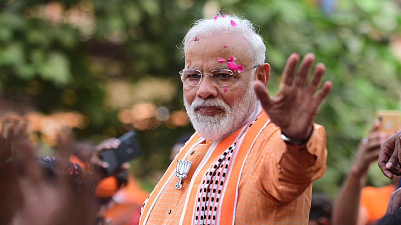 Indian Prime Minister Narendra Modi waves to his supporters during a road show in Varanasi, Uttar Pradesh (AAP)